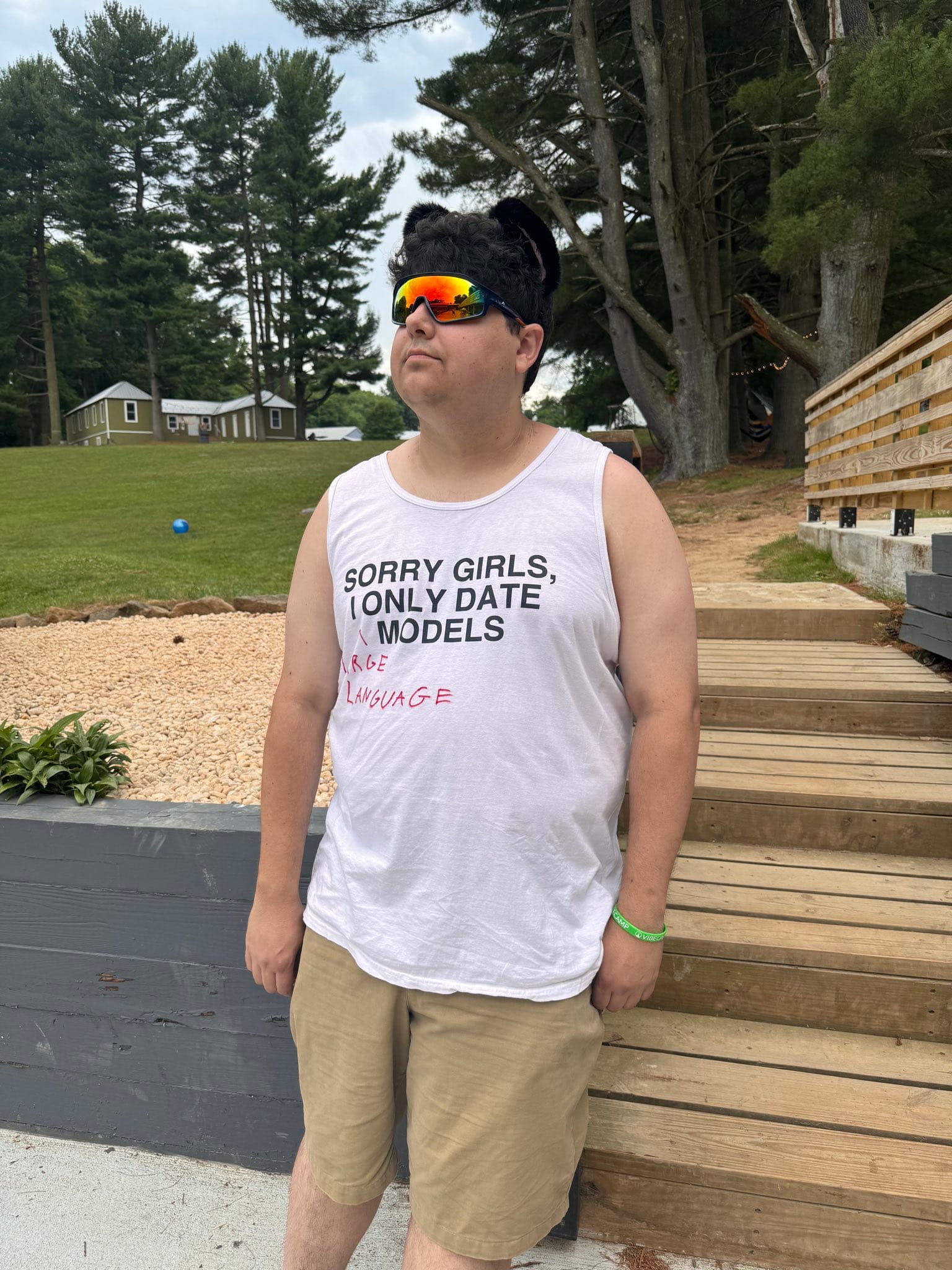 A Vibecamp attendee in a Large Language Models t-shirt